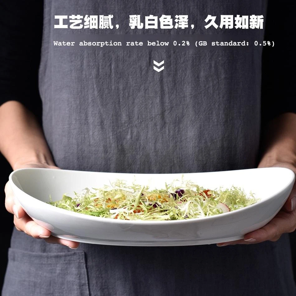 Glossy White Oval Ceramic Salad Bowl filled with mixed salad greens for commercial kitchen food presentation